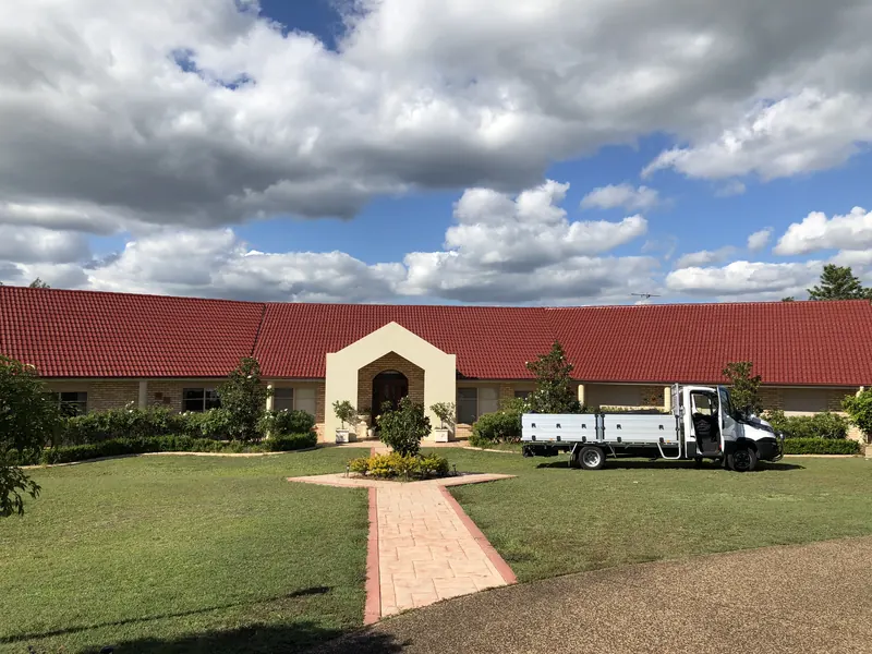 Restored red tile homestead with company ute