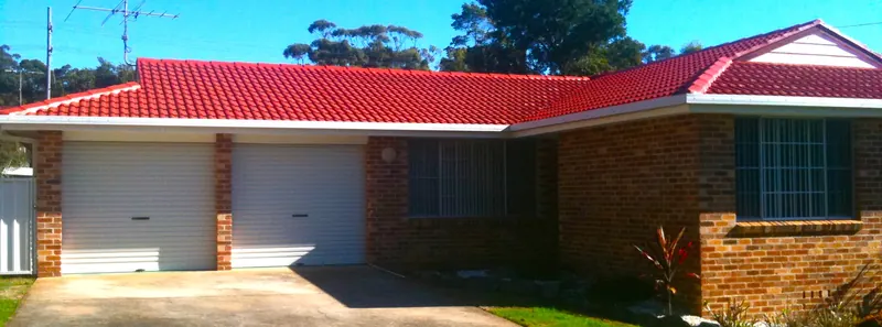 Red tile roof restored to a deep glossy finish